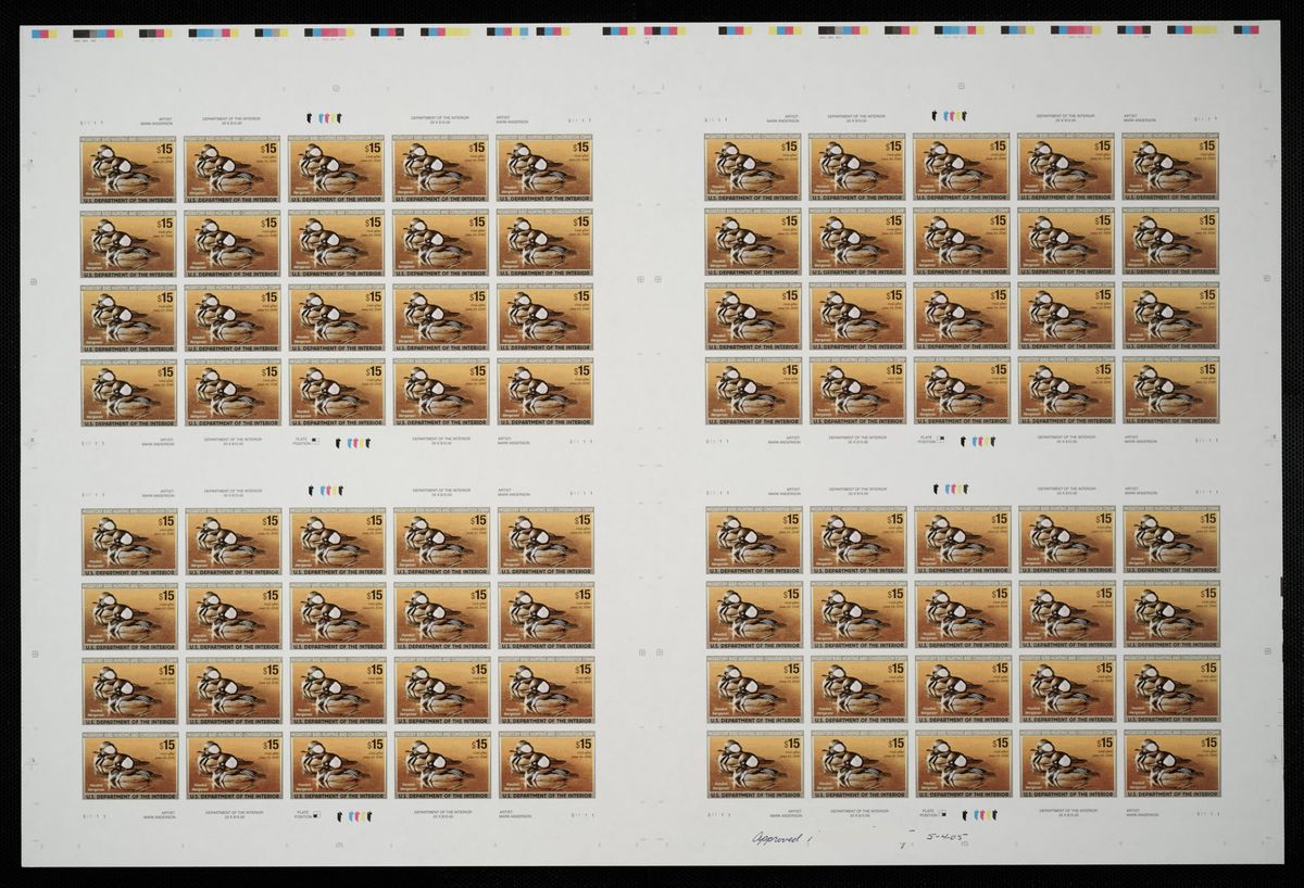 Sheets of hooded merganser stamps. The pair of swimming ducks are shades of brown with a white fan-shaped patch on the head.